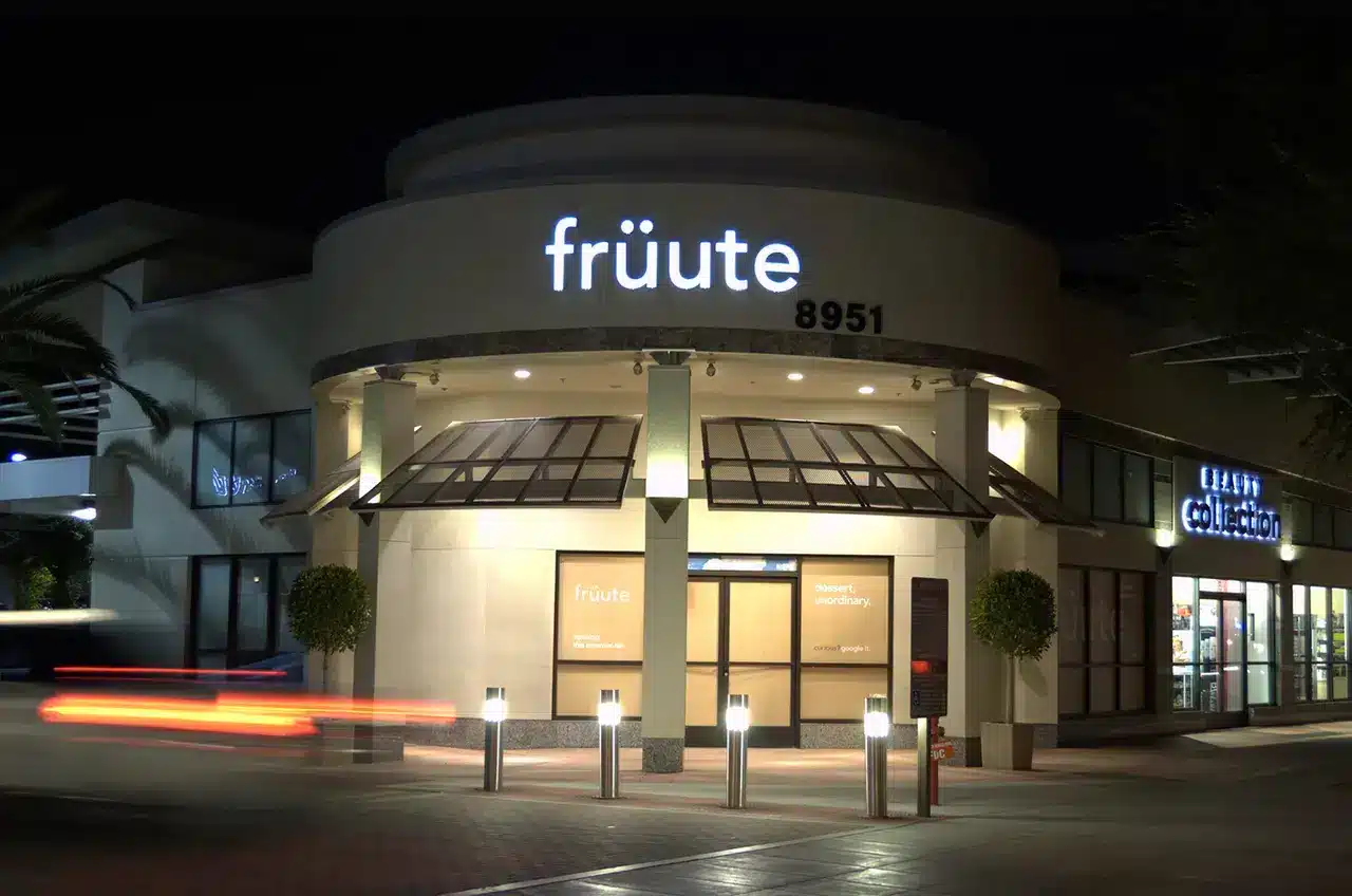 Illuminated channel letter storefront sign at night in Burbank, CA installed by Los Angeles Sign Company.