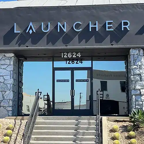 Illuminated channel letter storefront sign reading LAUNCHER in Glendale, CA